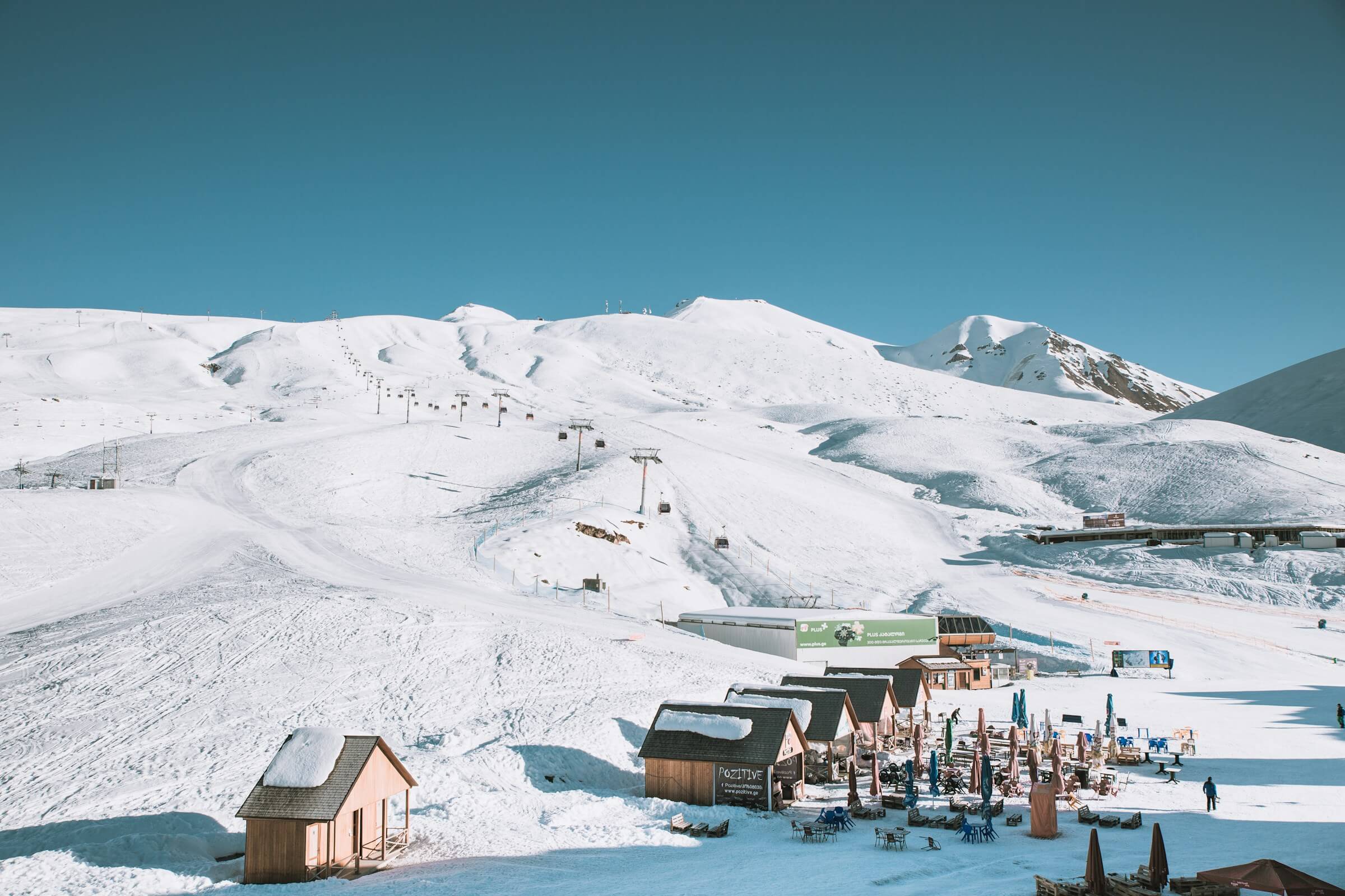 A chairlift rising over the snow-covered slopes of the Gudauri ski resort in the Caucasus