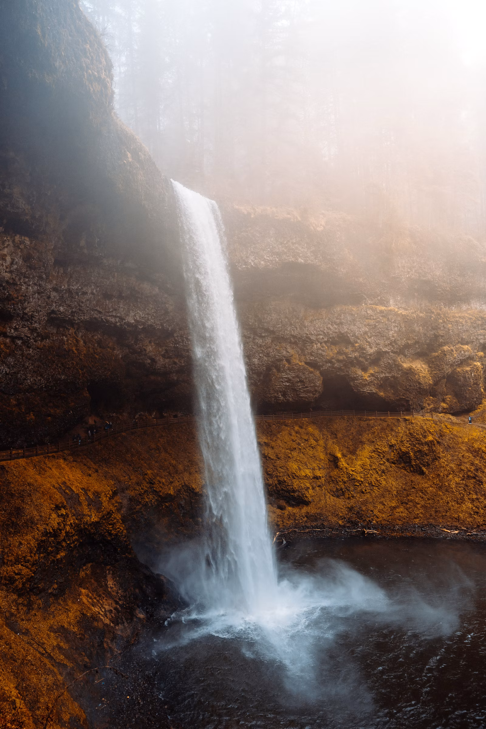 A waterfall cascading down a rocky cliff in a Georgian canyon