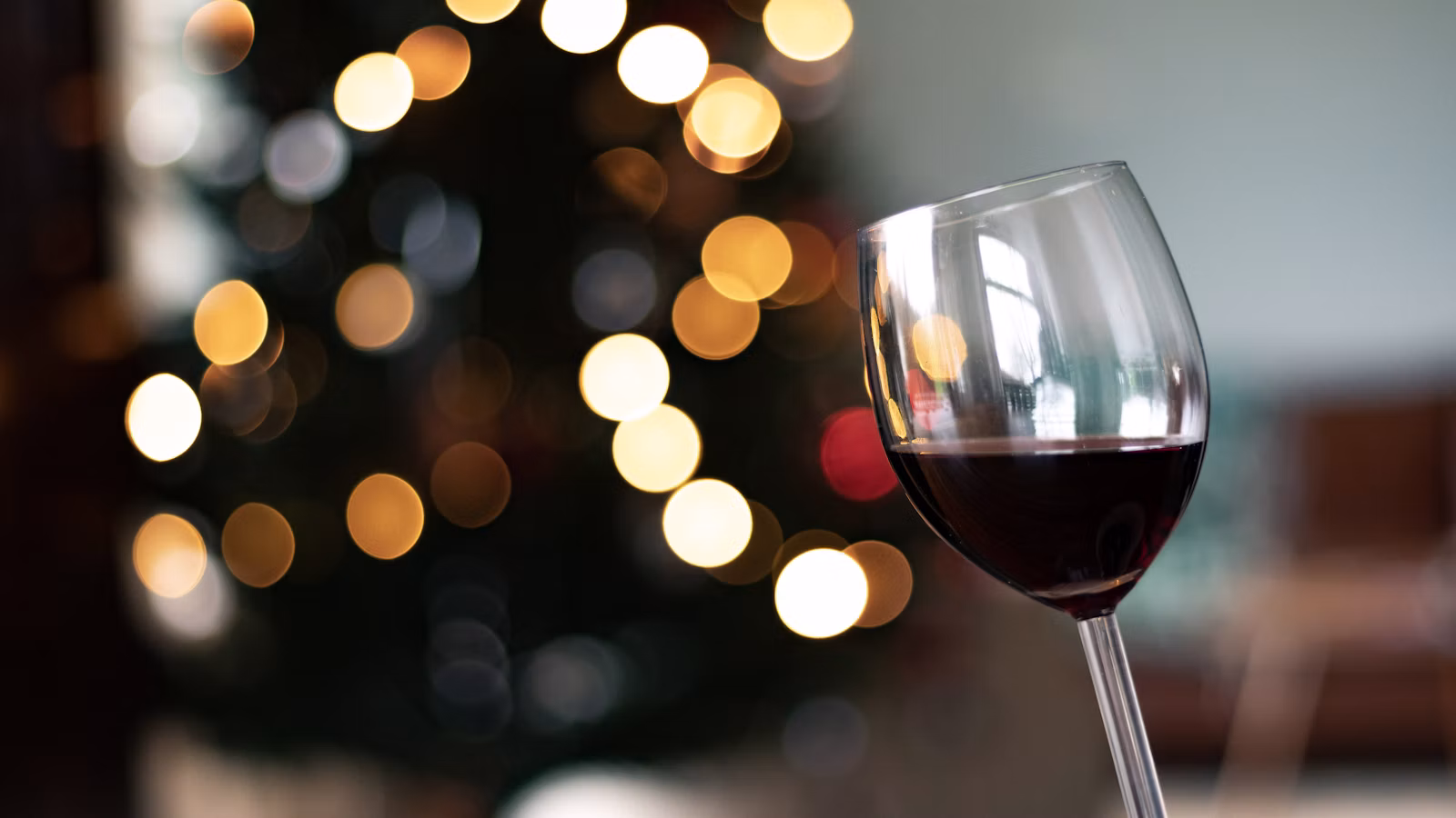 A glass of Georgian wine raised for a toast